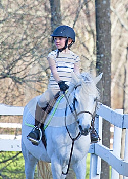 Girl at horseback riding lesson.