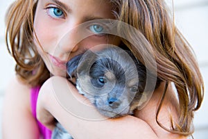 Girl hug a little puppy dog gray hairy chihuahua