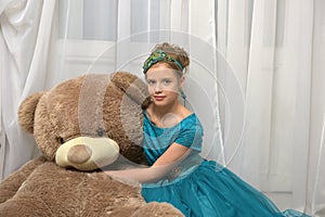 Girl with huge teddybear