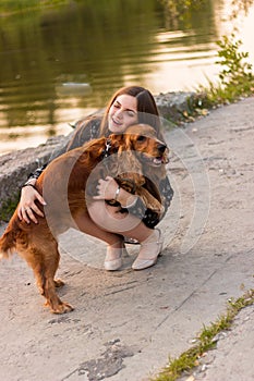 Girl hugging dog pet cute adorable red dog friendly closeup closing eyes funny animals
