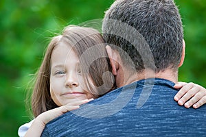 Girl hugging her father. Happy loving family. Dad and his daughter playing. Cute baby and daddy. Concept of Father day. Family hol