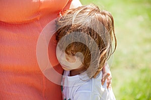 Girl hugging mather in the park