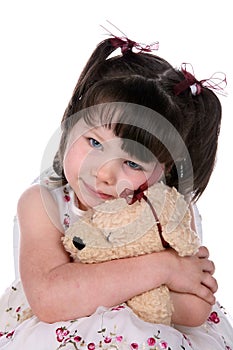 Girl hugging stuffed animal