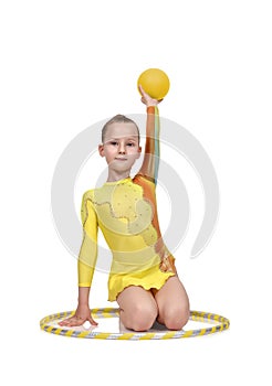 Girl with hula hoop and ball