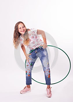 Girl with hula hoops on a white background