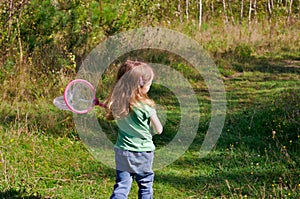 Girl hunting butterflies