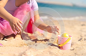 Girl hunting for easter eggs on the beach