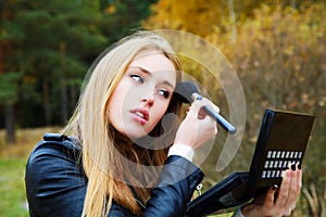 The girl imposes a make-up