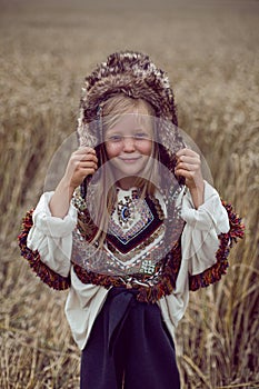 Girl Indian shaman blonde in a poncho