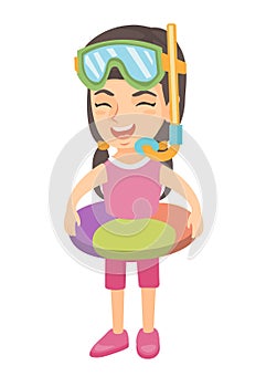 Girl with inflatable ring, diving mask and snorkel