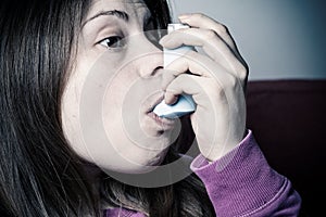 Girl inhales medicine