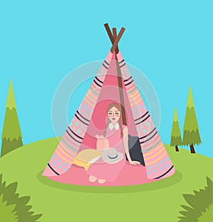 Girl inside teepee traditional native america tent relaxing enjoy camping in green landscape