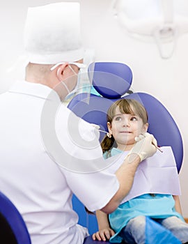 Girl during inspection of oral cavity