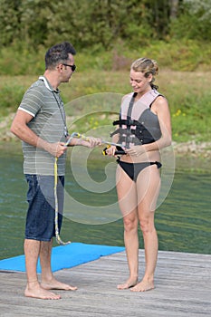 Girl and instructor wakeboarding