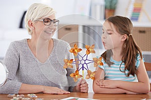 Girl interested in paper windmill