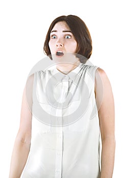 A girl isolated on a white background. Shocked girl. Scared professional lady. Brunette young woman in a blouse.