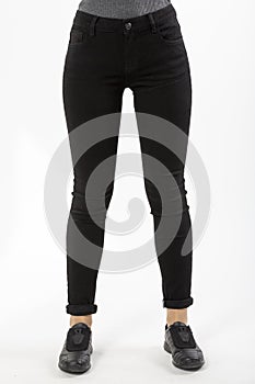 Girl in jeans shows jeans on a white background close-up