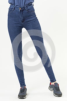 girl in jeans shows off jeans on white background close up