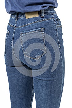 girl in jeans shows off jeans on white background close up
