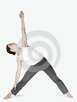 Girl in a joga triangle pose