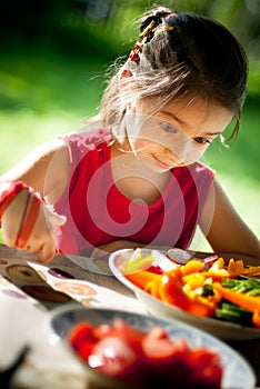 Girl joyfully is surprised to tasty vegetables