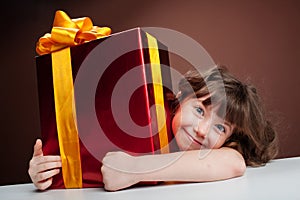 Girl joyously embraces the present photo