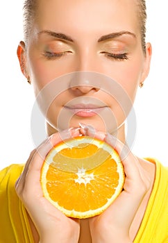 Girl with juicy orange