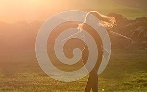 Girl jump against beautiful sunset in forest