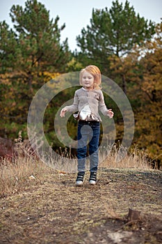 Girl in a jump in the forest