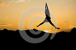 Girl jump on the sky under sunset light