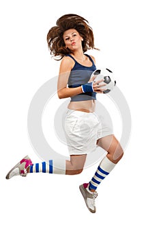 Girl jumpig with soccer ball