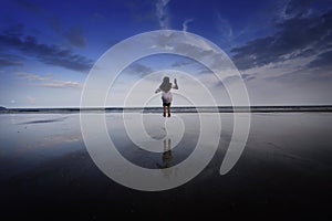 A girl jumping at beach