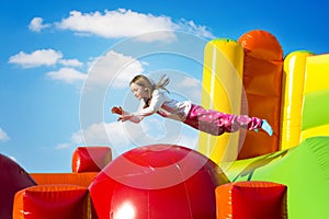 Girl Jumping on Castle photo