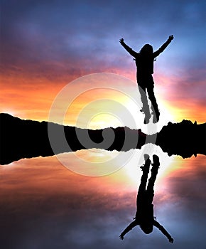 Girl jumping at dusk