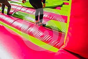 Girl jumping and exercising while having fun in an inflatable castle to bounce