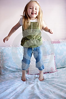 Girl Jumping on her bed