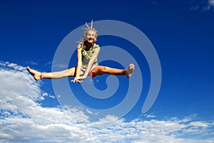 Girl jumping high in air