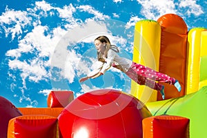 Girl Jumping on an Inflate Castle