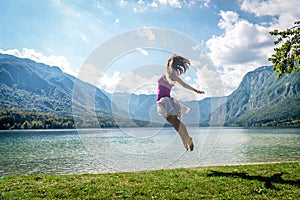 Girl jumping on the lake