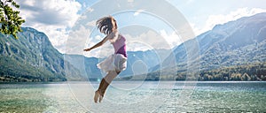 Girl jumping on the lake