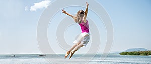 Girl jumping on the lake