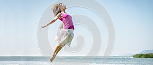 Girl jumping on the lake