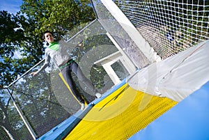 Girl jumping on moon-bounce