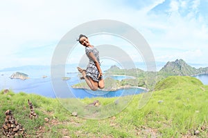 Girl jumping on Padar Island