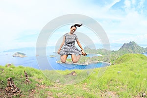 Girl jumping on Padar Island photo