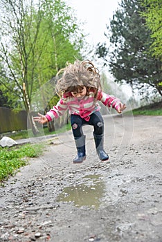 Girl jumping in a paddle