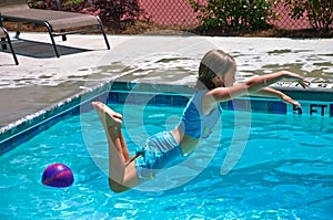 Girl Jumping into a Pool