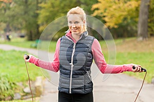 Girl jumping rope in park