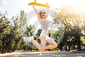 Girl jumping with skateboard