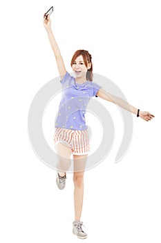 girl jumping with smart phone in the hand